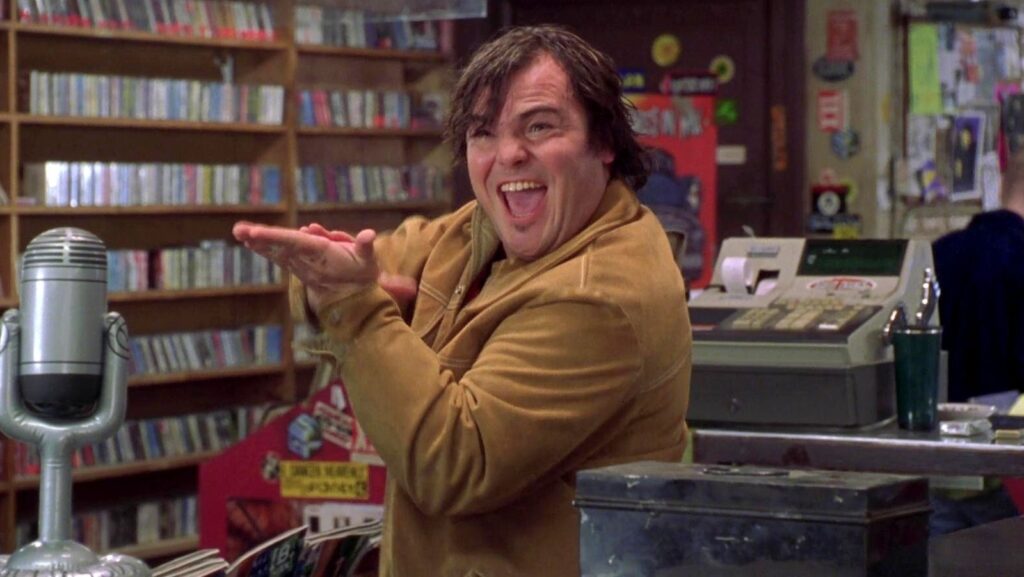 Jack Black em cena de Alta Fidelidade (2000). Distribuição: Buena Vista Pictures Distribution.